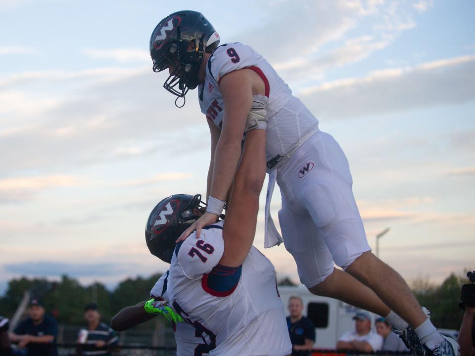 “From the moment we came in during the summer, you could tell it was going to be a dream year,” said West quarterback Carson Jessie, here being lifted by Jones Conner after a touchdown run against Alcoa on Sept. 22, 2022.