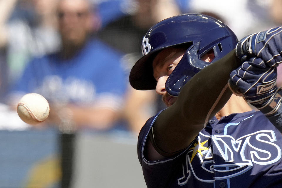 Tampa Bay Rays' Jonny DeLuca (21) keeps his eye on the ball as he hits it foul during the fourth inning of a baseball game against the Toronto Blue Jays, Saturday, May 18, 2024, in Toronto. (Chris Young/The Canadian Press via AP)