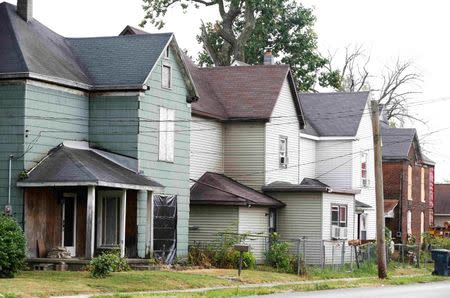 Boarded up and run down homes sit on a street in Muncie, Indiana, U.S., August 13, 2016. REUTERS/Chris Bergin