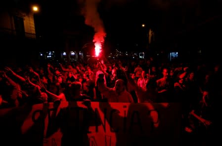 Demonstrators attend a protest after a verdict in a trial over a banned independence referendum, in Barcelona