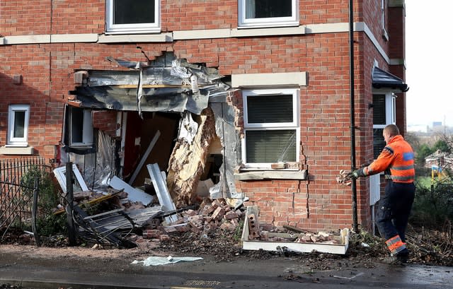 A gaping hole left in a house on Chester Road in Helsby, Cheshire after a gritting lorry crashed into it (Martin Rickett, PA Wire)