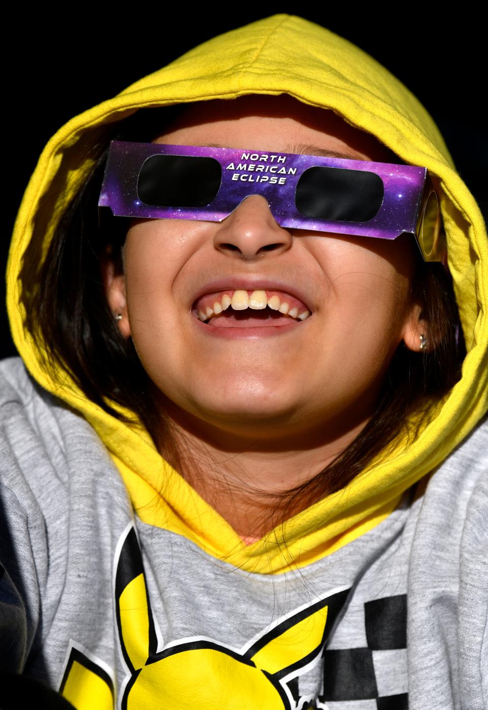 Jeanine Campos, 9, watches the annular eclipse of the sun at San Angelo State Park Oct. 14. Jeanine and her family drove out from the Dallas area to see it.