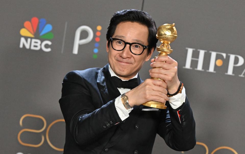 US-Vietnamese actor Ke Huy Quan poses with the award for Best Supporting Actor - Motion Picture for 