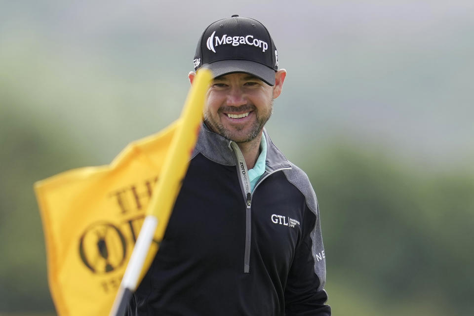 United States' Brian Harman smiles after he chips onto the 5th green, where he made his 4th birdie in a row, during the second day of the British Open Golf Championships at the Royal Liverpool Golf Club in Hoylake, England, Friday, July 21, 2023. (AP Photo/Kin Cheung)