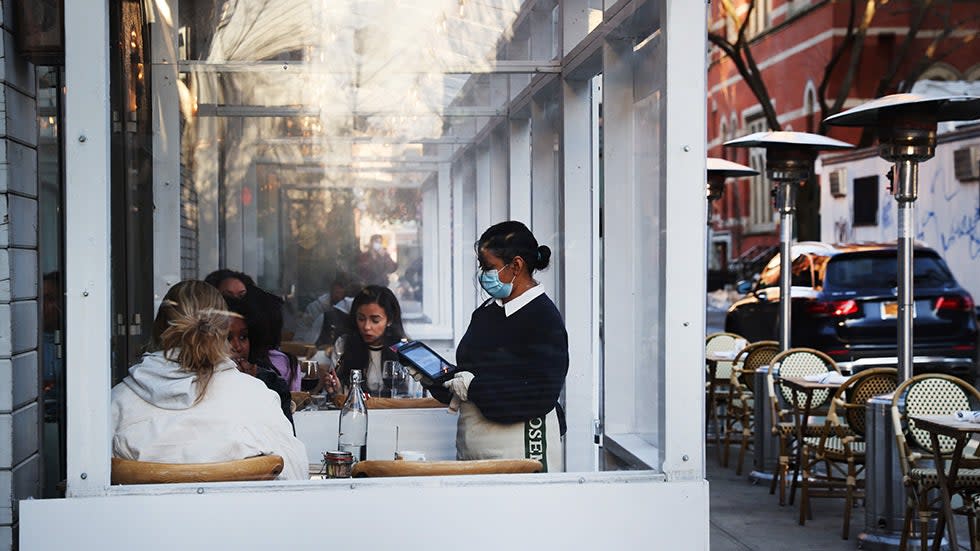 Diners eat outside at a New York City restaurant