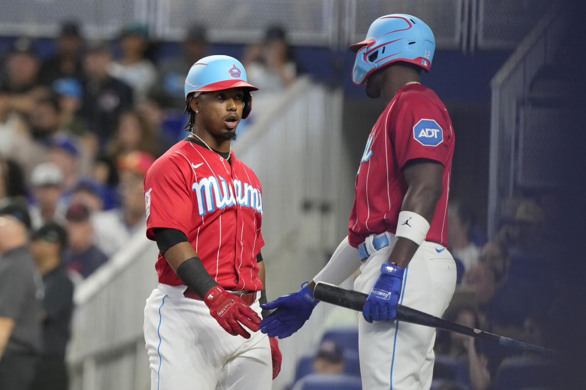 Luis Arraez of the Miami Marlins, congratulates Johnny Cueto of