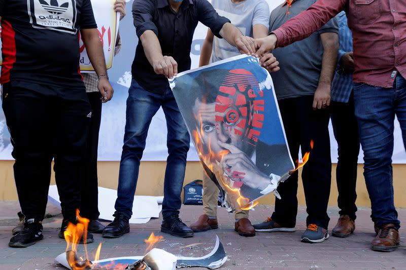 Palestinians gather to protest against the publications of a cartoon of Prophet Mohammad