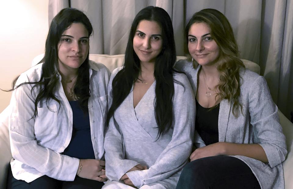 In this Nov. 5, 2019, photo, from left, Guila, Macy and Zoya Fakhoury, three of Amer Fakhoury's four daughters, gather in Salem, N.H. Amer Fakhoury, a U.S. citizen living in Dover, N.H., went to visit family in his native Lebanon in September after a 20-year absence, and has been jailed there by authorities since. (AP Photo/Kathy McCormack)