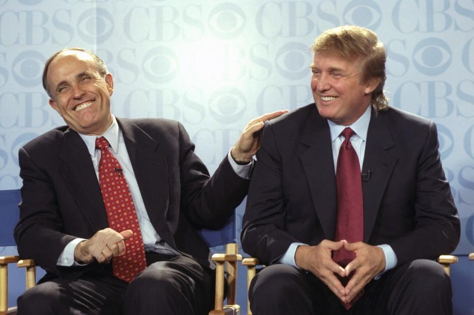 New York Mayor Rudy Giuliani and Donald Trump at a May 1999 news conference at the GM Building, where CBS announced that Bryant Gumbel will be the host of its new morning news program, "This Morning." The show would be broadcast from Trump's International Plaza Building.