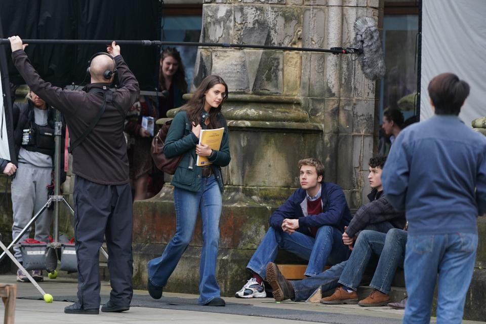 Actress Meg Bellamy, who plays Kate Middleton, and actor Ed McVey, who plays the part of Prince William, film scenes for the next season of The Crown in St Andrews in Scotland. Picture date: Friday March 17, 2023.