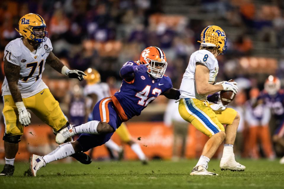 Clemson linebacker LaVonta Bentley (42) pressures Pittsburgh quarterback Kenny Pickett (8) during the fourth quarter of their game at Memorial Stadium.