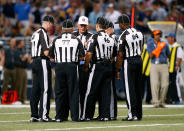 ST LOUIS, MO - SEPTEMBER 16: Replacement referees huddle during a timeout in the game between the Washington Redskins and the St. Louis Rams at Edward Jones Dome on September 16, 2012 in St Louis, Missouri. (Photo by Jamie Squire/Getty Images)