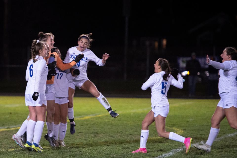 The Blue Raiders celebrate their 2-0 win over the Maynard Tigers in the Division 5, round of 16 playoff game at Alumni Field in Maynard, Nov. 8, 2023.