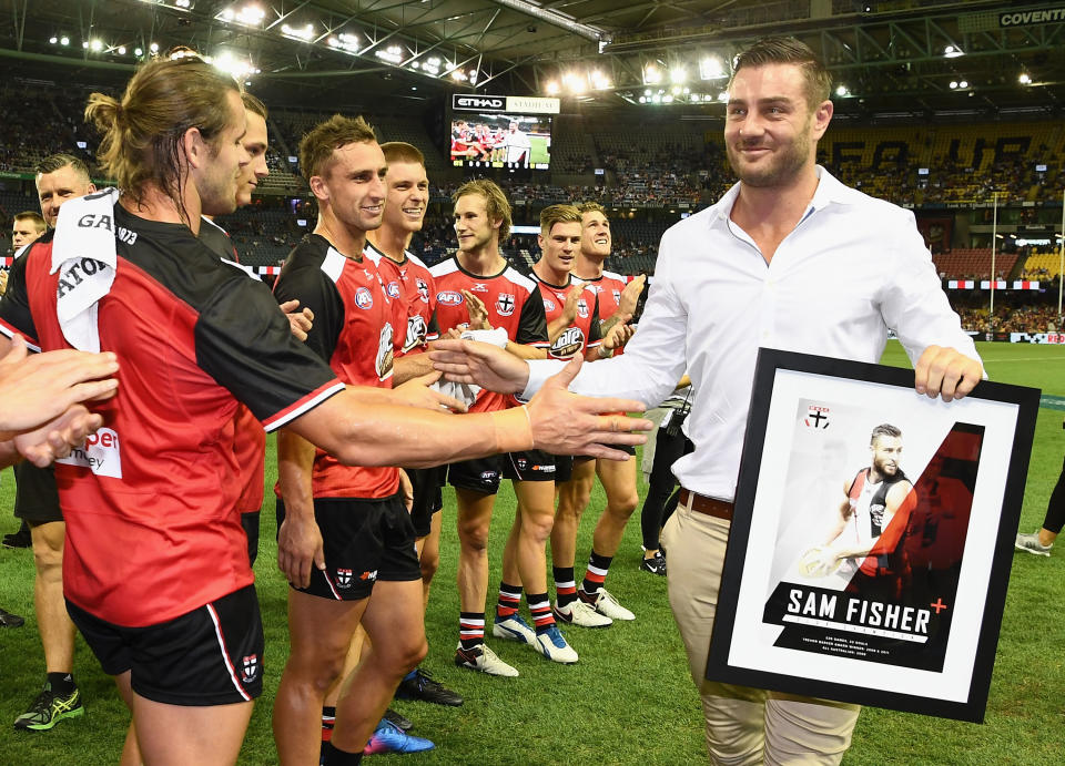 St Kilda players, pictured here forming a guard of honour for Sam Fisher after his retirement in 2017.