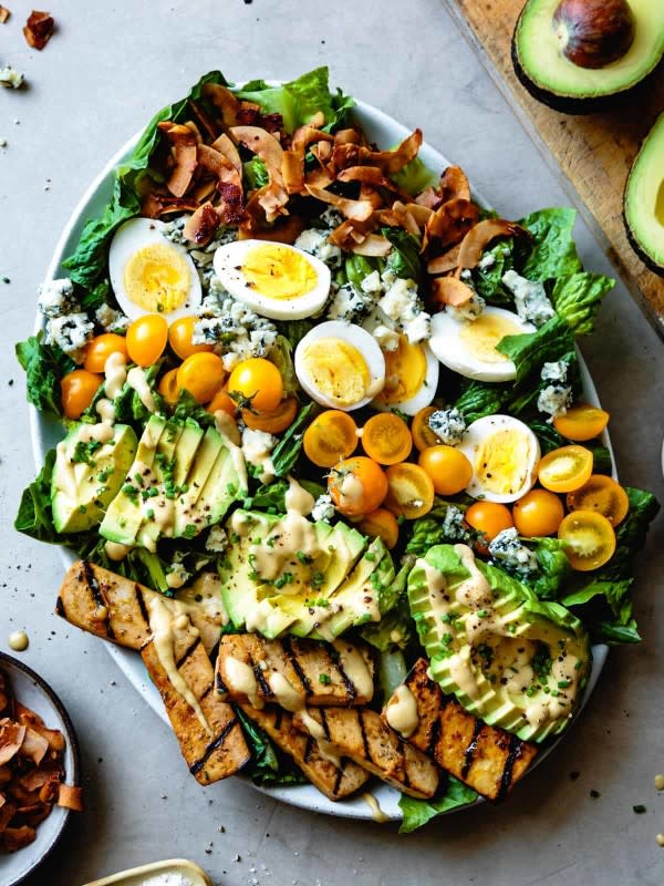 <p>The Bojon Gourmet</p><p>You can enjoy a Cobb salad with lots of protein like smoky coconut bacon and healthy fats with a ripe avocado and a delicious creamy mustard vinaigrette to marry the textures and flavors. </p><p><strong>Get the recipe here: <a href="https://bojongourmet.com/vegetarian-cobb-salad-grilled-tofu-coconut-bacon/" rel="nofollow noopener" target="_blank" data-ylk="slk:Vegetarian Cobb Salad with Grilled Tofu and Coconut Bacon;elm:context_link;itc:0;sec:content-canvas" class="link ">Vegetarian Cobb Salad with Grilled Tofu and Coconut Bacon</a></strong></p>