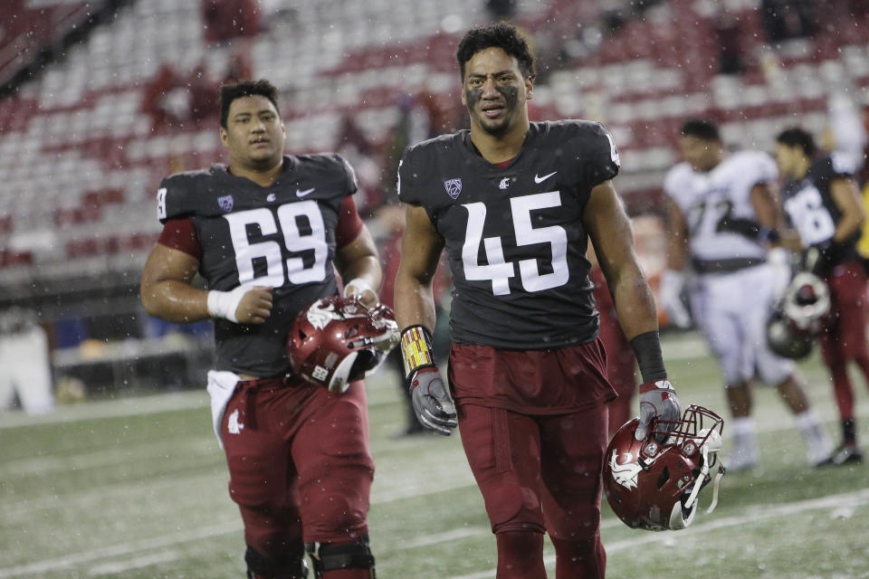 Washington State LB Logan Tago (R) was ordered to complete 240 hours of community service in January. (AP)