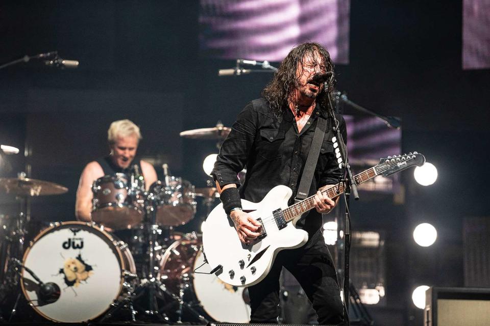 <p>Erika Goldring/Getty </p> Josh Freese and Dave Grohl of the Foo Fighters perform in Tennessee in June 2023