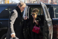 Former Alaska Governor Sarah Palin arrives at federal court with former NHL hockey player Ron Duguay in New York on Friday, Feb. 11, 2022. Palin claims the New York Times damaged her reputation with an editorial linking her campaign rhetoric to a mass shooting. (AP Photo/Jeenah Moon)