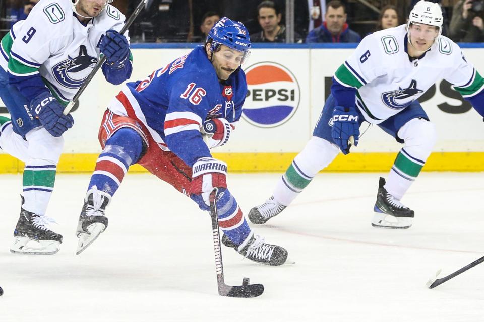 Jan 8, 2024; New York, New York, USA; New York Rangers center Vincent Trocheck (16) controls the puck in the first period against the Vancouver Canucks at Madison Square Garden.