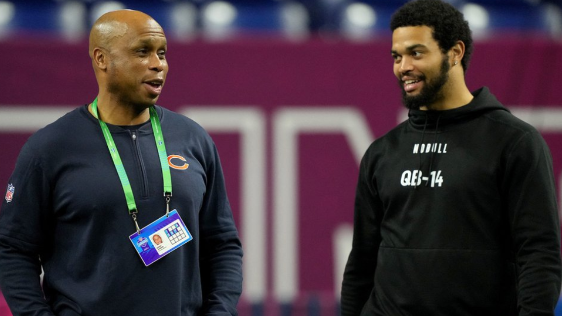 Chicago Bears quarterbacks coach Kerry Joseph talking to Southern California quarterback Caleb Williams during the 2024 NFL Combine