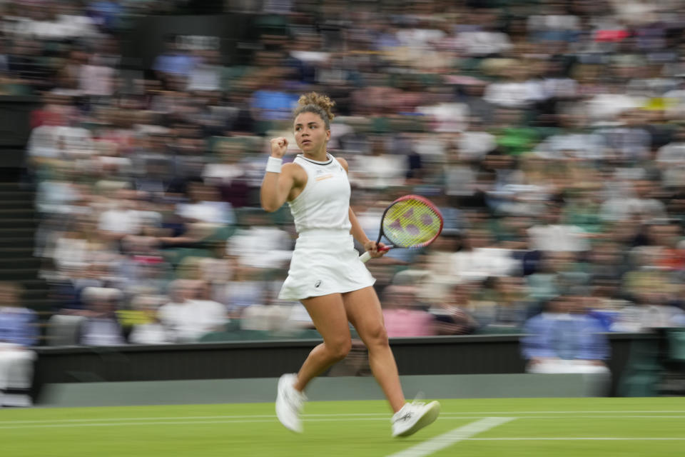 Jasmine Paolini of Italy reacts after winning a point against Emma Navarro of the United States during their quarterfinal match at the Wimbledon tennis championships in London, Tuesday, July 9, 2024. (AP Photo/Alberto Pezzali)