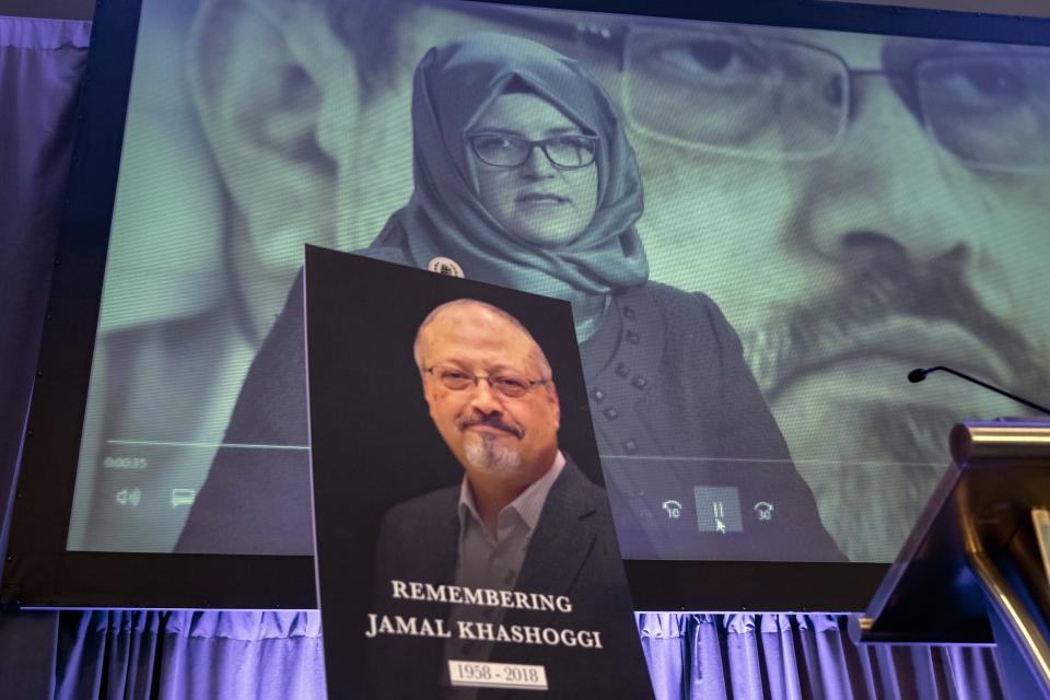 FILE - In this Nov. 2, 2018 file photo, a video image of Hatice Cengiz, fiancee of slain Saudi journalist Jamal Khashoggi, is played during an event to remember Khashoggi, who died inside the Saudi Consulate in Istanbul on Oct. 2, 2018, in Washington. The killing of Washington Post columnist Jamal Khashoggi at the Saudi Consulate in Istanbul drew renewed scrutiny to the kingdom, as his son and a U.N. investigator spoke out Tuesday, Oct. 1, 2019, ahead of the anniversary of his death. (AP Photo/J. Scott Applewhite, File)