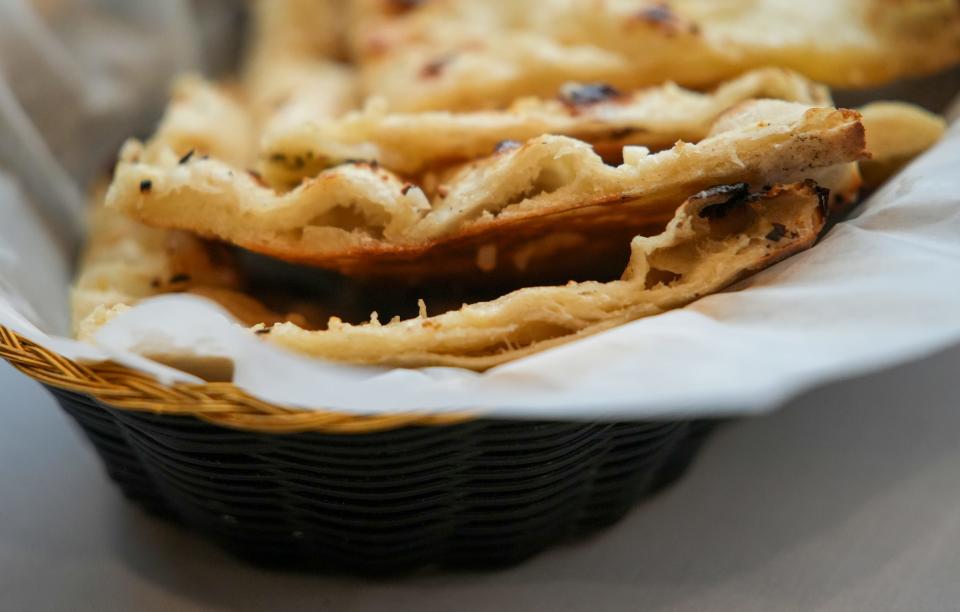 Garlic naan, a soft fragrant bread at Yak and Yeti in Fishers, Monday, Oct. 30, 2023, a Himalayan restaurant that serves dishes from the region near Nepal.