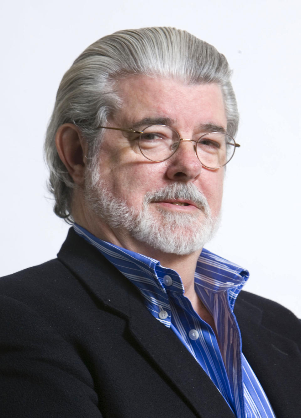 FILE - In this March 13, 2008, file photo, director/producer George Lucas poses for portrait in Las Vegas. The Northern California city of San Anselmo has approved a new downtown park to be built on land donated by Lucas that will feature statues of Indiana Jones and Yoda, two of his most popular characters. (AP Photo/Matt Sayles, File)