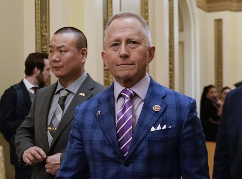 FILE - In this Dec. 18, 2019 file photo, Rep. Jeff Van Drew of New Jersey departs after the House of Representatives voted to impeach President Donald Trump on two charges, abuse of power and obstruction of Congress, at the Capitol in Washington. Trump is coming next week to the Jersey shore to reward newly minted Republican Rep. Jeff Van Drew for leaving the Democrats and opposing impeachment and is expected to attract a crowd and headlines. But Van Drew has also been crisscrossing the district to secure support from local GOP that he spent years fighting.(AP Photo/J. Scott Applewhite, File)