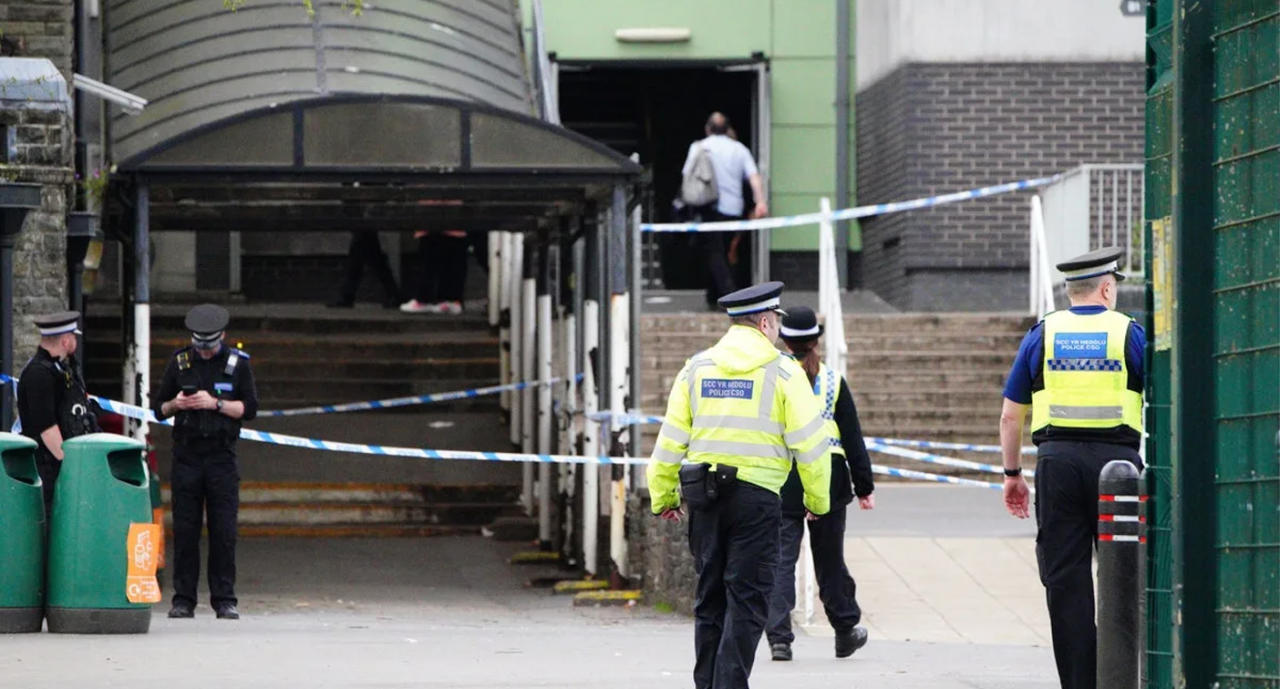 Police close off the school as investigations continue. Source: PA