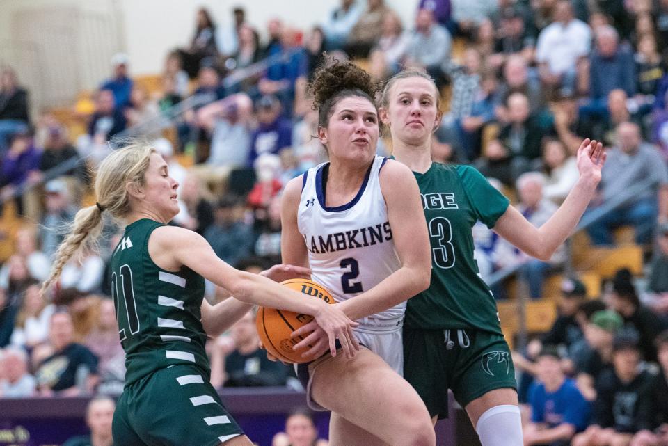 Fort Collins girls basketball's Avery Alcaraz (2) looks to shoot the ball during a city rivalry boys-girls doubleheader against Fossil Ridge on Tuesday, January 30, 2024, at Fort Collins High School in Fort Collins, Colo. The Lambkins won 65-50.