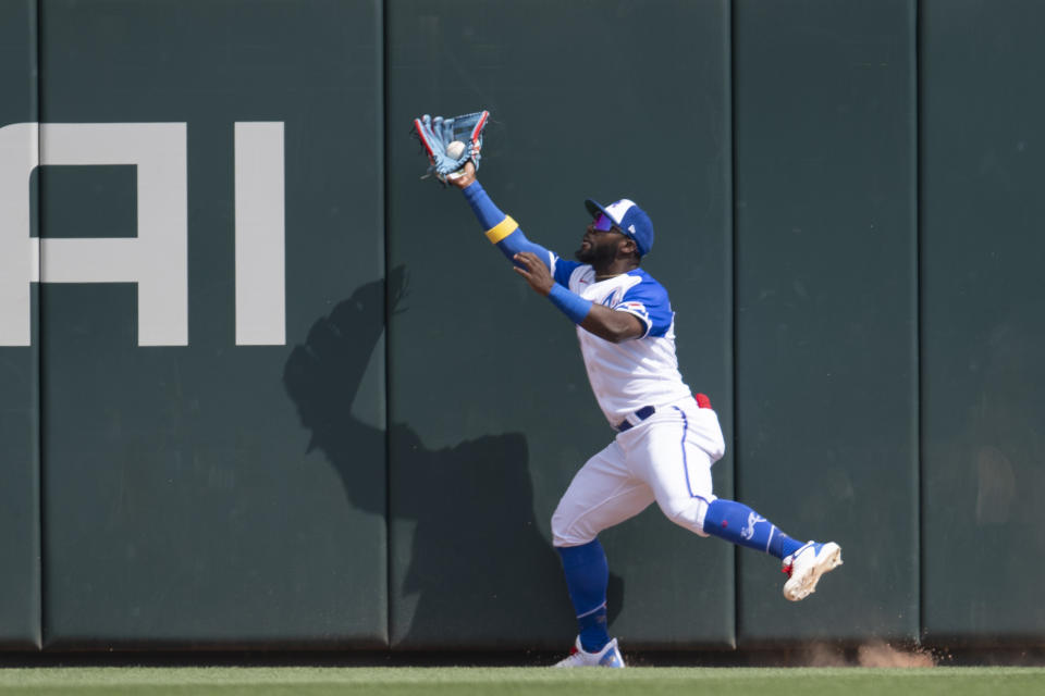 Atlanta Braves center fielder Michael Harris II catches a fly ball at the wall in the first inning of a baseball game against the Washington Nationals, Saturday, June 10, 2023, in Atlanta. (AP Photo/Hakim Wright Sr.)