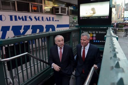 William Bratton, Police Commissioner (L) and Mayor of New York City, Bill de Blasio, arrive in Times Square by subway in the Manhattan borough in New York, March 22, 2016. REUTERS/Stephanie Keith
