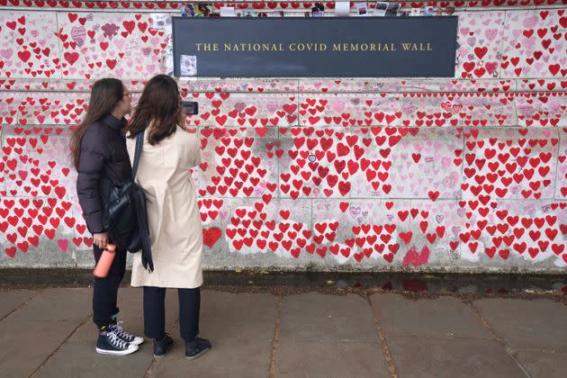 Visitors to the National Covid Memorial Wall in London (Photo: Jonathan Brady - PA Images via Getty Images)