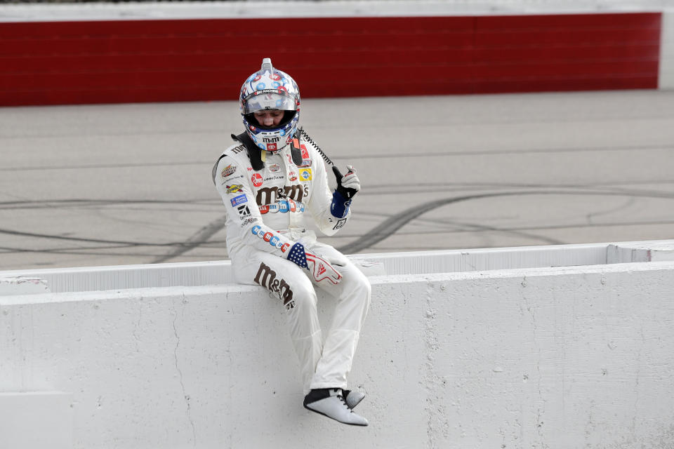 Kyle Busch sits on the pit wall after finishing second to Chase Briscoe in the NASCAR Xfinity series auto race Thursday, May 21, 2020, in Darlington, S.C. (AP Photo/Brynn Anderson)