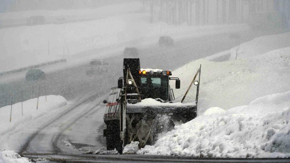 Snow falls as a Caltrans snowblower clears the Donner Pass Road on ramp near Inrerstate 80 in 2016. 