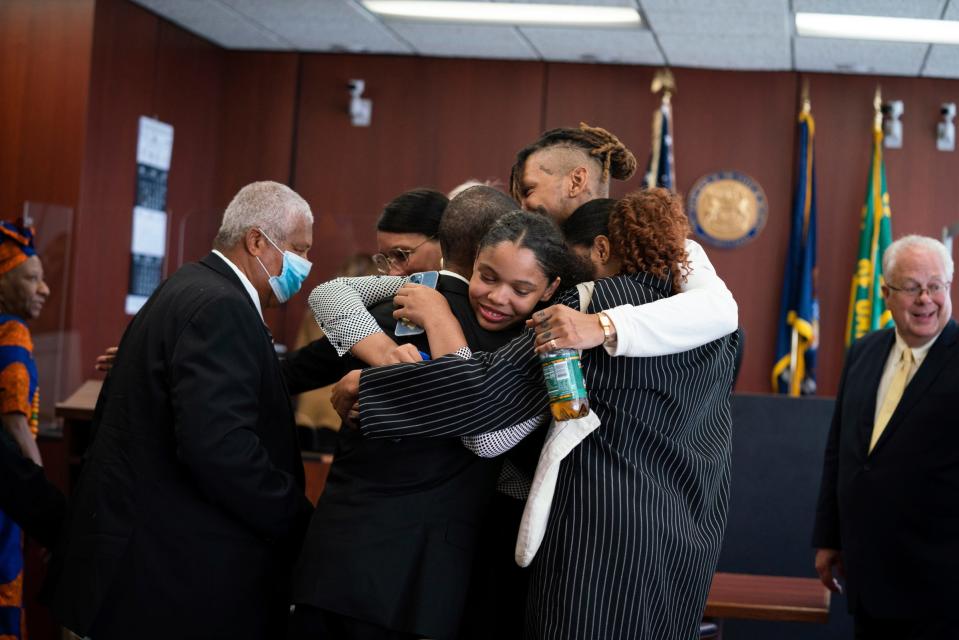 Aretha Franklin’s son Edward Franklin, left, celebrates as his brother Kecalf Franklin is embraced by his children Grace, 17, Jordan, 28, and Victorie Franklin, 24, after the jury decided in favor of a 2014 document during a trial over Aretha Franklin’s wills at Oakland County Probate Court in Pontiac on Tuesday, July 11, 2023.