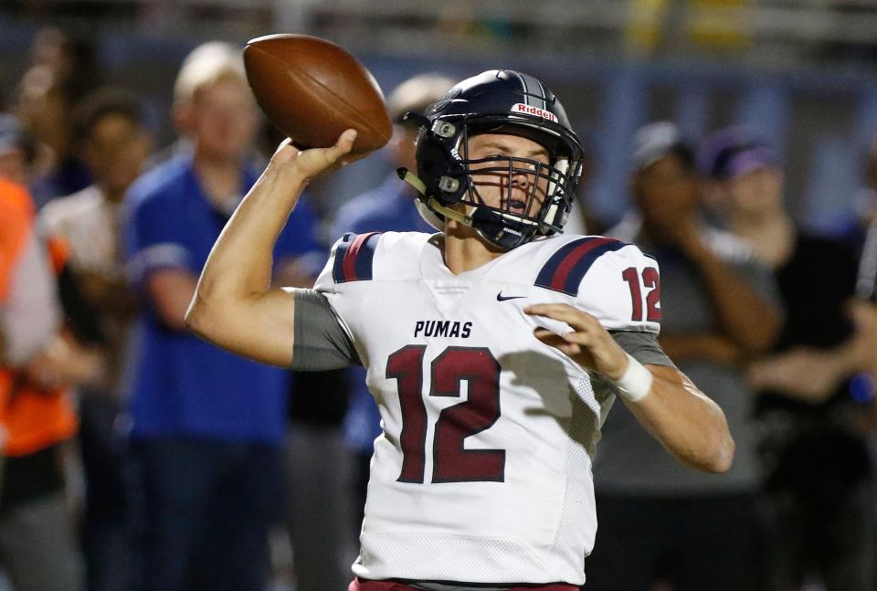 Perry quarterback Chubba Purdy (12)  throws a pass against Chandler's defense during their game in Chandler, Friday, Oct. 04, 2019. 