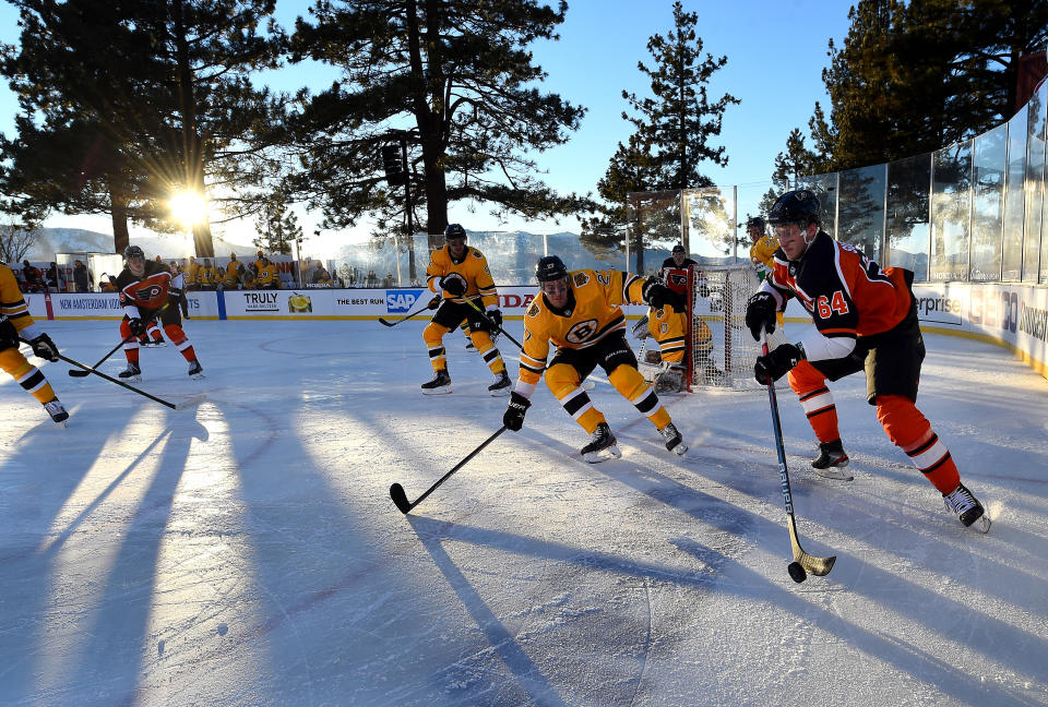 <p>Maksim Sushko #64 of the Philadelphia Flyers controls the puck out of the corner against John Moore #27 of the Boston Bruins during the first period of the 2021 NHL Outdoors Sunday presented by Honda on the 18th fairway of the Edgewood Tahoe Resort, at the south shore of Lake Tahoe on February 21, 2021 in Stateline, Nevada. (Photo by Brian Babineau/NHLI via Getty Images)</p> 