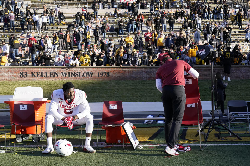 Arkansas defensive lineman Dorian Gerald sits on the bench following a 50-48 loss to Missouri in an NCAA college football game Saturday, Dec. 5, 2020, in Columbia, Mo. Missouri won the game on a last-second field goal by Harrison Mevis. (AP Photo/L.G. Patterson)