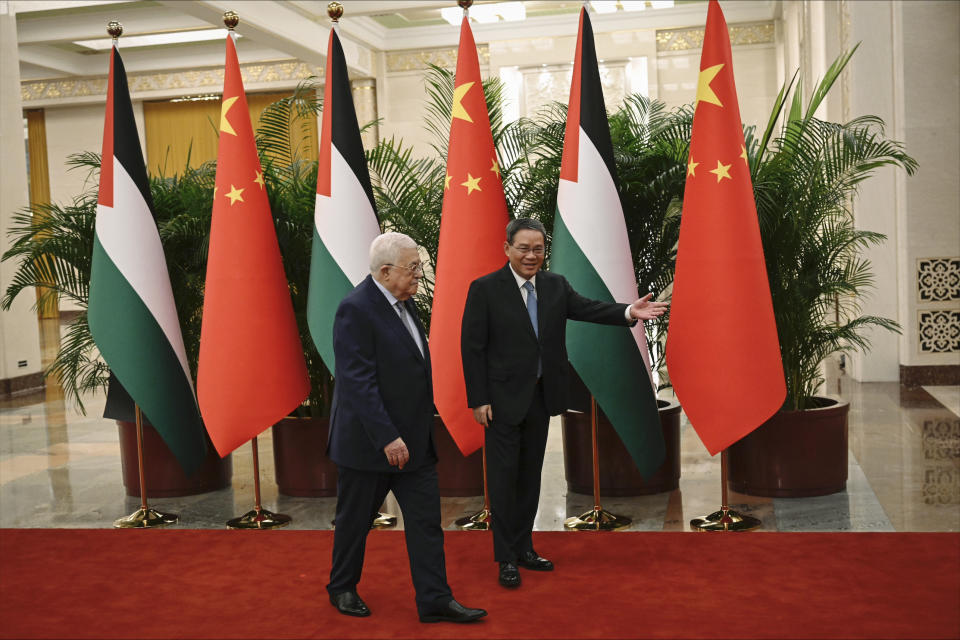 Chinese Premier Li Qiang, right, receives Palestinian President Mahmud Abbas at the Great Hall of the People in Beijing on Thursday, June 15, 2023. (Jade Gao/Pool Photo via AP)