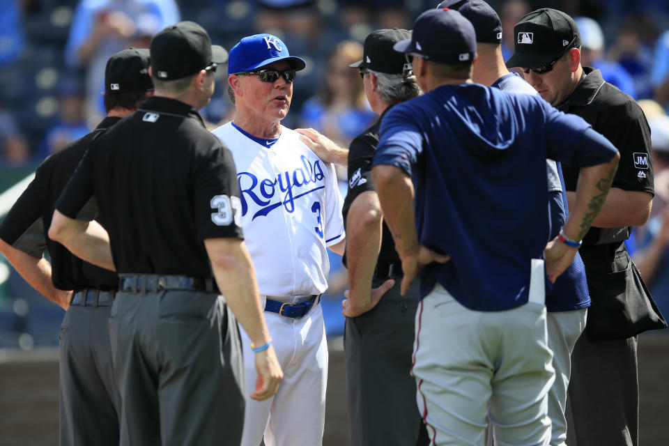 Kansas City Royals manager Ned Yost (3) exchanges lineup cards before a baseball game against the Minnesota Twins at Kauffman Stadium in Kansas City, Mo., Sunday, Sept. 29, 2019. Yost is managing his last game for the Royals. (AP Photo/Orlin Wagner)