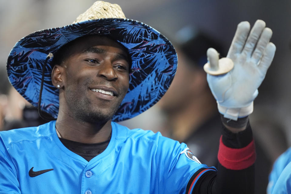 Miami Marlins' Nick Gordon celebrates with teammates after he hit a home run scoring Jesus Sanchez and Josh Bell during the first inning of a baseball game against the Seattle Mariners, Sunday, June 23, 2024, in Miami. (AP Photo/Wilfredo Lee)