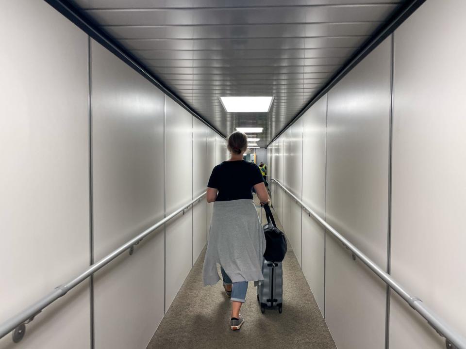 The Insider author entered a nearly empty jet bridge as she boarded the Air New Zealand flight.