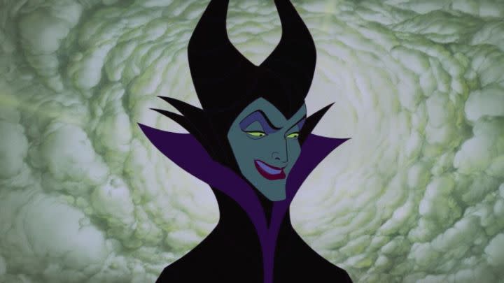 Maleficent smiling wickedly in the film Sleeping Beauty.