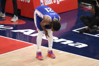 Philadelphia 76ers center Joel Embiid (21) reacts after he fell on the court during the first half of Game 4 in a first-round NBA basketball playoff series against the Washington Wizards, Monday, May 31, 2021, in Washington. (AP Photo/Nick Wass)