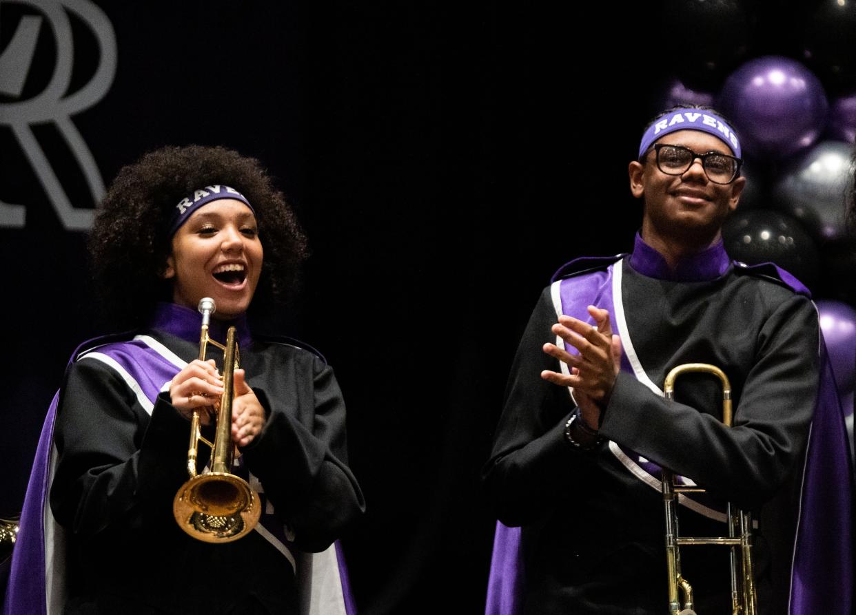 Alayah Dailey and David Groves III react after hearing their band director, Johnny Croft, received a CMA Music Teachers of Excellence Award on Wednesday.