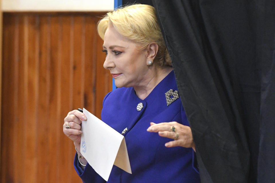 Former Prime Minister and presidential candidate for the Social Democratic party Viorica Dancila exits a voting cabin in Bucharest, Romania, Sunday, Nov. 10, 2019. Voting got underway in Romania's presidential election after a lackluster campaign overshadowed by a political crisis which saw a minority government installed just a few days ago. (AP Photo/Andreea Alexandru)