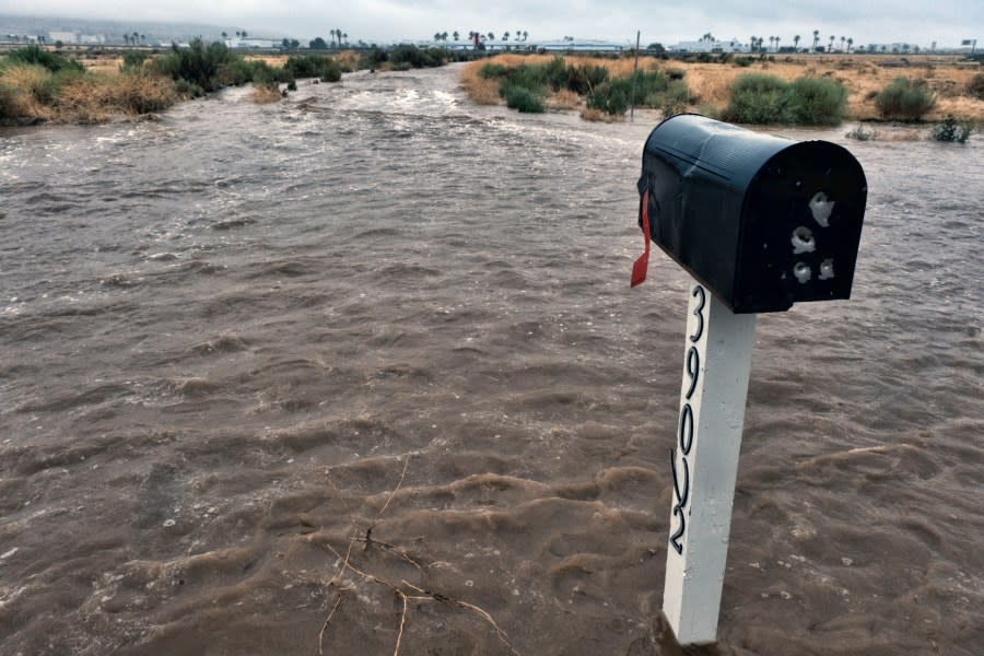 A mailbox stands on a flooded residential street in Palmdale, Calif. as a tropical storm moves into the area on Sunday, Aug. 20, 2023. Forecasters said Tropical Storm Hilary was the first tropical storm to hit Southern California in 84 years, bringing the potential for flash floods, mudslides, isolated tornadoes, high winds and power outages. (AP Photo/Richard Vogel)