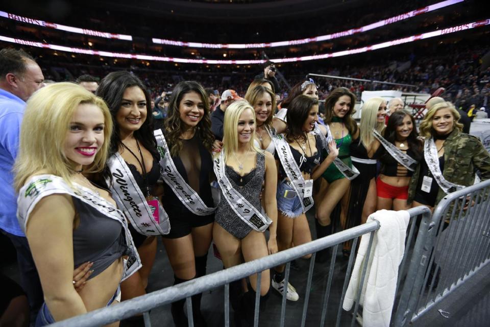 Wingettes parade at Wing Bowl on Friday, Feb. 3, 2017 in Philadelphia. The morning eating ordeal draws boozy spectators who tailgate beforehand outside the city's sports arena to watch flamboyant contestants. This year, rapper Coolio performed between rounds. (David Swanson/The Philadelphia Inquirer via AP)